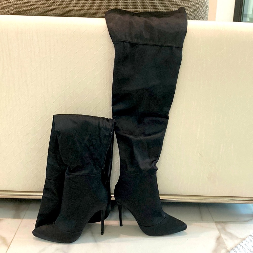 Black satin nights over the knee boots.